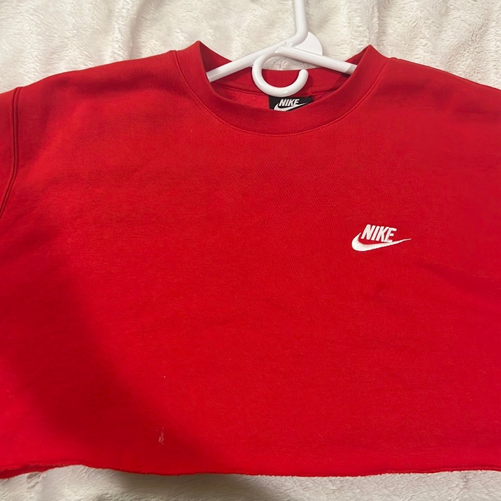 red cropped nike sweatshirt.